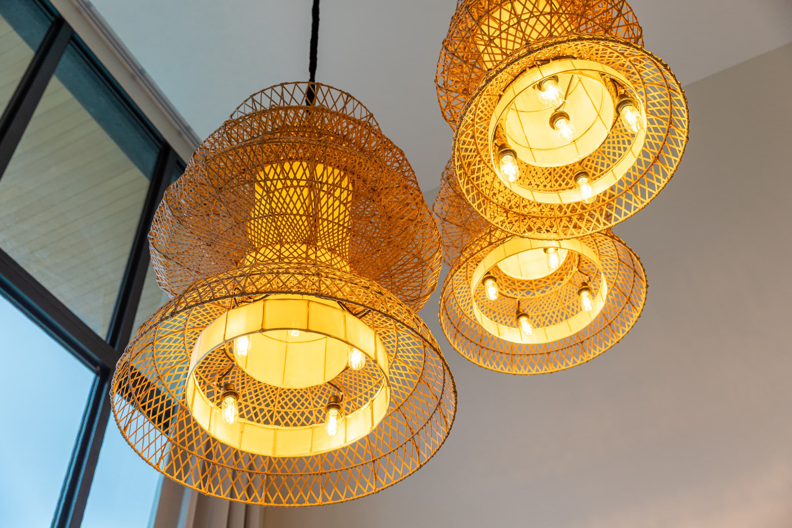Rattan lamps in the double-height hall